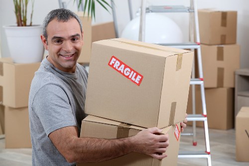 Furniture removals team handling a flat move in Bow
