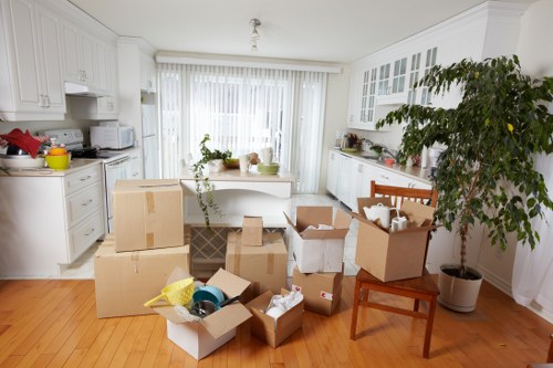 Professional movers handling furniture transport and loading in Bow