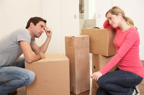 Loading furniture and boxes into a van for a Bow collection