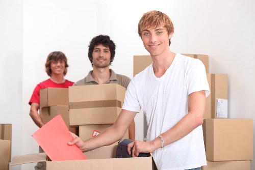 Boxes and furniture prepared for storage near Bow